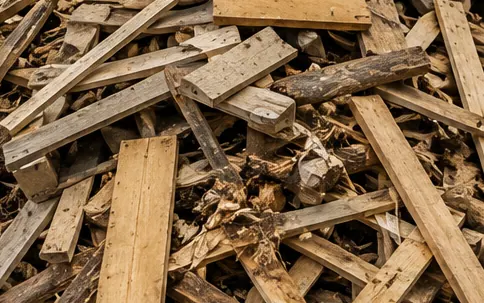 Pile of offcut timber and pallet wood waiting to be chipped