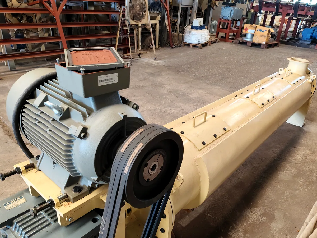 THOR ball mill drum with its belt drive, gear reducer and motor mounted on a common base frame